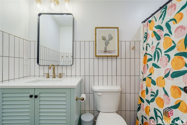 bathroom with toilet, vanity, tile walls, and a shower with curtain