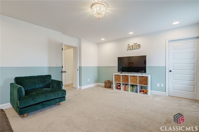 sitting room featuring carpet