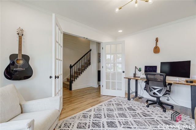 office area with ornamental molding, french doors, and hardwood / wood-style flooring