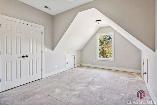 bonus room featuring vaulted ceiling