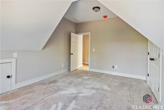 additional living space with vaulted ceiling