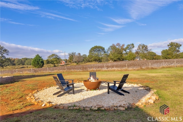 view of yard with an outdoor fire pit