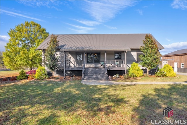 view of front of property with covered porch and a front lawn