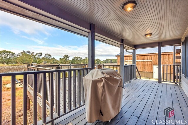 wooden deck featuring grilling area