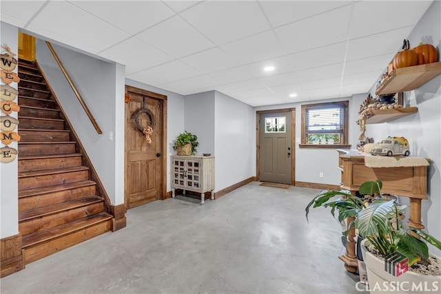 foyer featuring a drop ceiling