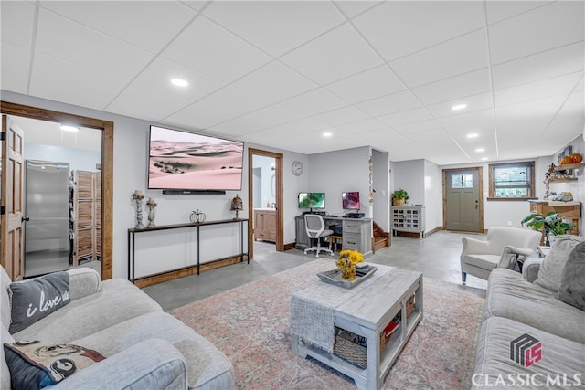 living room with a paneled ceiling