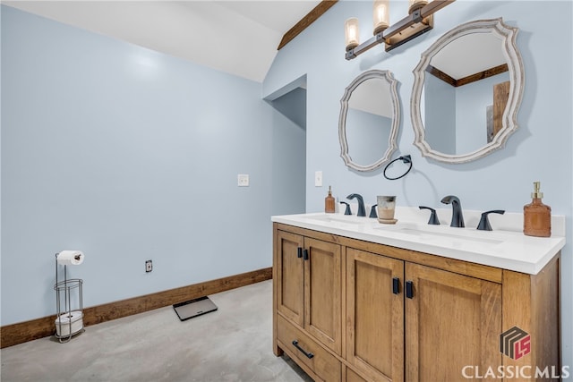 bathroom featuring lofted ceiling and vanity