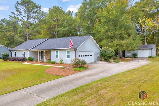 view of front of house featuring a front yard and a garage