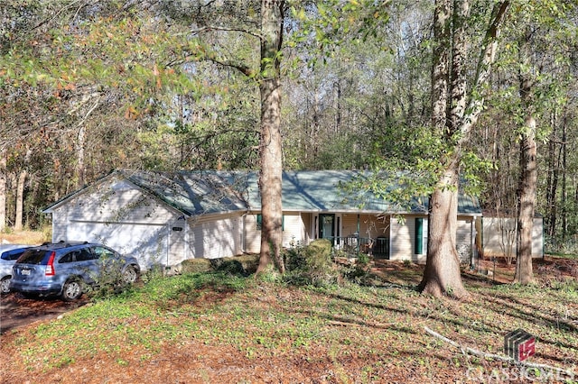 single story home featuring covered porch