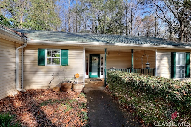 entrance to property with a porch