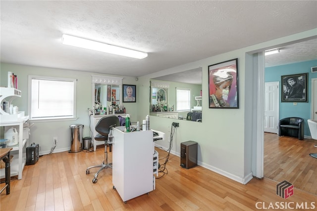 office space featuring hardwood / wood-style floors and a textured ceiling