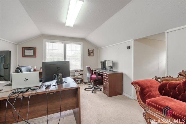 home office with a textured ceiling, carpet floors, and lofted ceiling