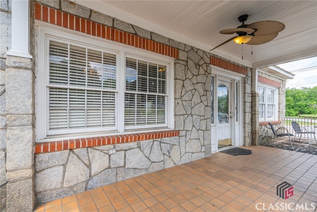 entrance to property with ceiling fan