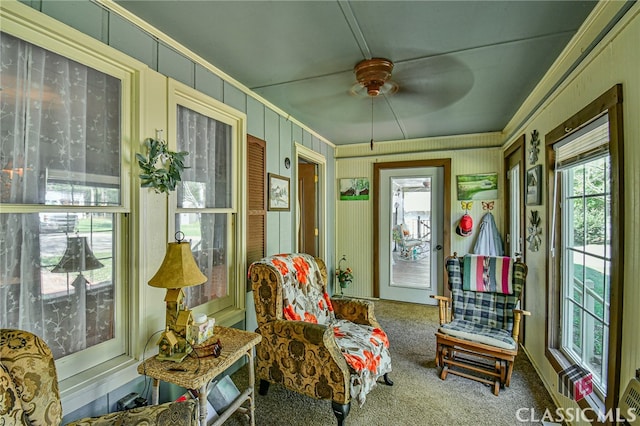 sunroom / solarium with ceiling fan