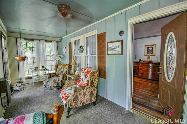 sunroom featuring ceiling fan