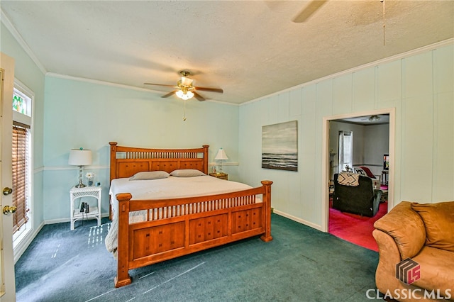 carpeted bedroom with a textured ceiling, ceiling fan, and ornamental molding