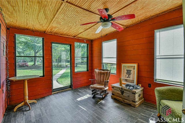 sunroom / solarium featuring wood ceiling and a wealth of natural light