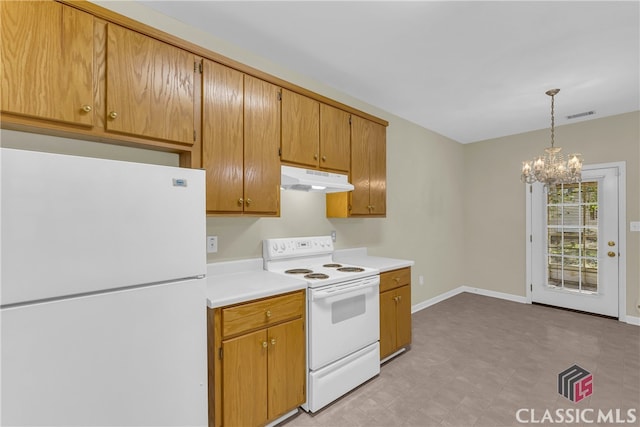 kitchen with pendant lighting, a notable chandelier, and white appliances