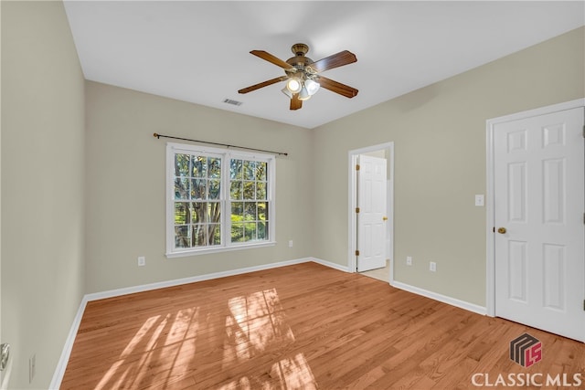 unfurnished bedroom with ceiling fan and light hardwood / wood-style flooring