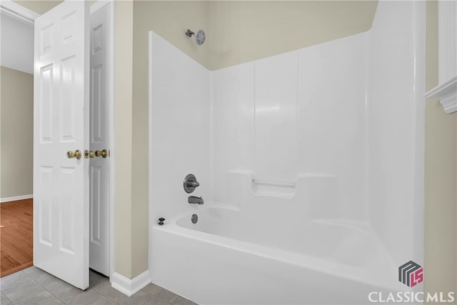 bathroom featuring tile patterned floors and shower / bath combination