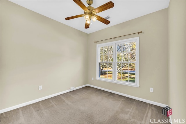 unfurnished room with carpet flooring and ceiling fan