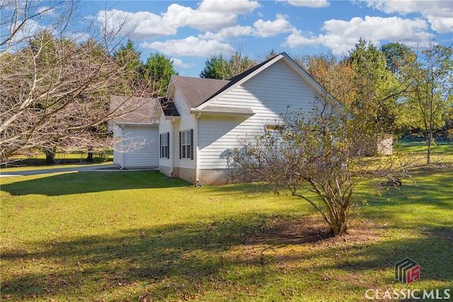 view of property exterior featuring a lawn