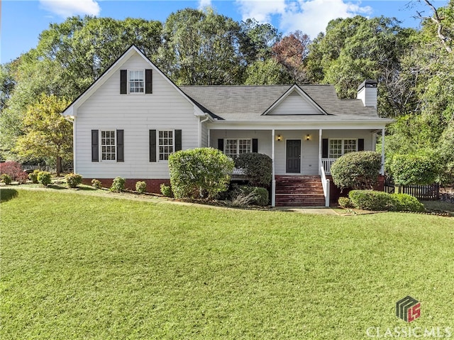 view of front facade with covered porch and a front yard