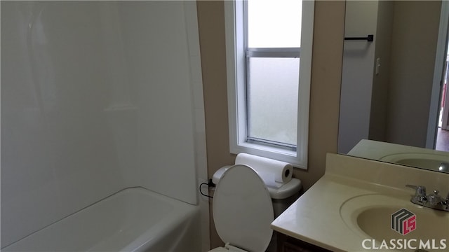 bathroom featuring vanity and toilet