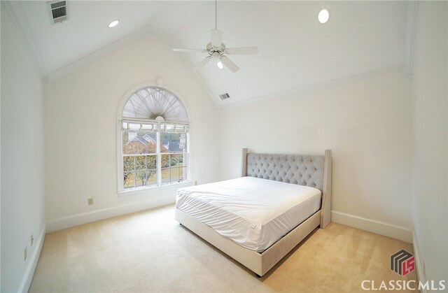 carpeted bedroom with ceiling fan and lofted ceiling