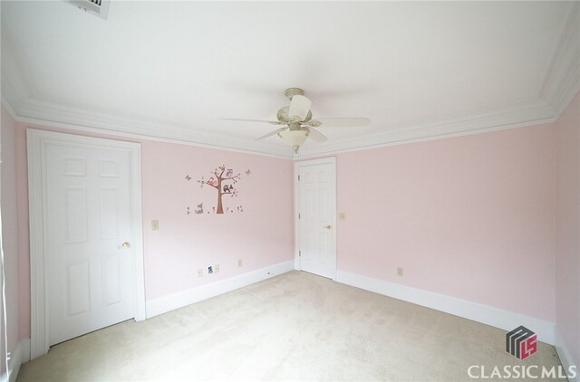 unfurnished room with light carpet, crown molding, and ceiling fan