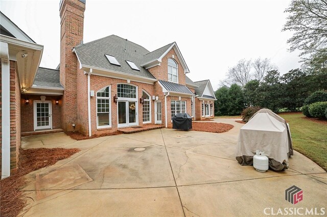 rear view of property featuring a patio