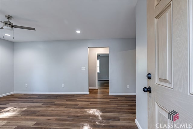 unfurnished room with ceiling fan and dark hardwood / wood-style flooring