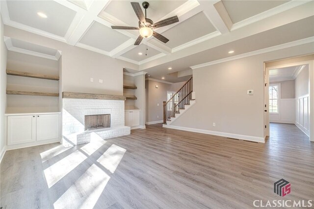 kitchen with white cabinets, light stone countertops, and stainless steel appliances