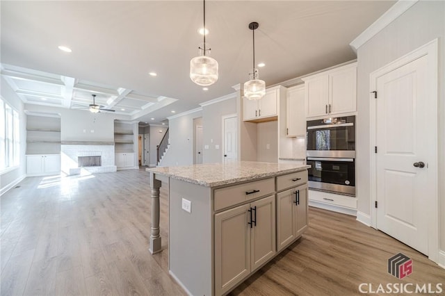 unfurnished dining area featuring crown molding, a notable chandelier, and hardwood / wood-style flooring