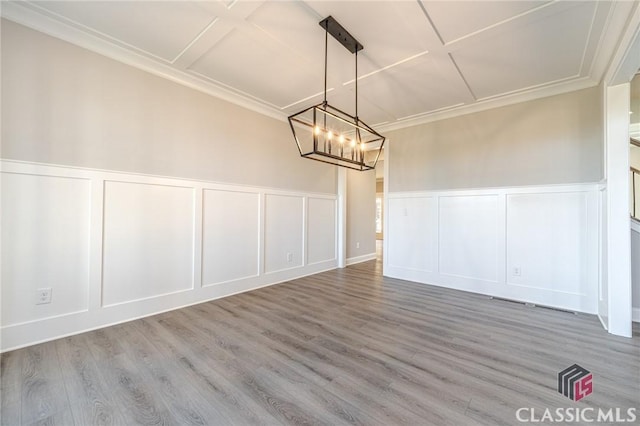 spare room with light hardwood / wood-style floors and ornamental molding