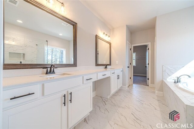 bathroom featuring shower with separate bathtub