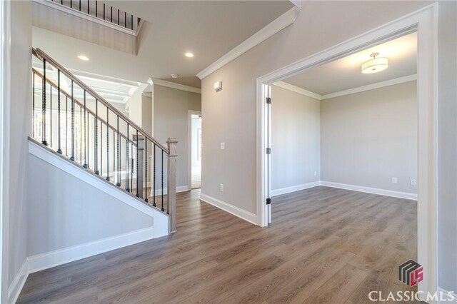 unfurnished living room with ceiling fan, coffered ceiling, and light wood-type flooring