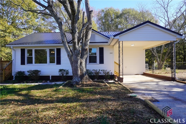 ranch-style home with a carport