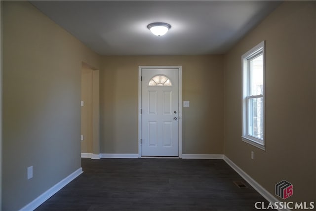 foyer entrance featuring dark hardwood / wood-style floors