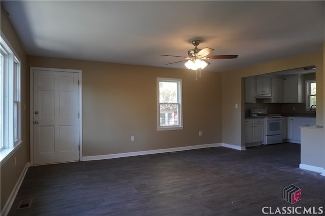 kitchen featuring white electric range oven, ceiling fan, white cabinetry, and dark wood-type flooring