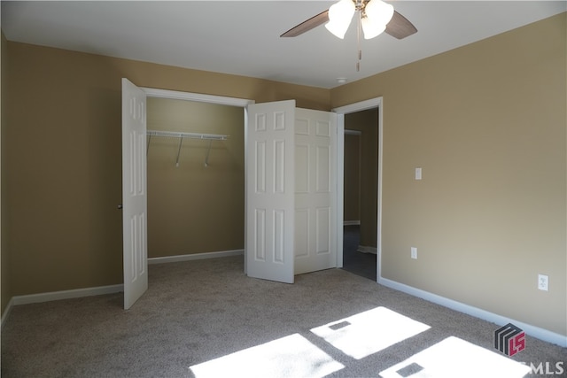 unfurnished bedroom with ceiling fan, light colored carpet, and a closet