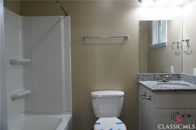 full bathroom featuring shower / washtub combination, vanity, and toilet