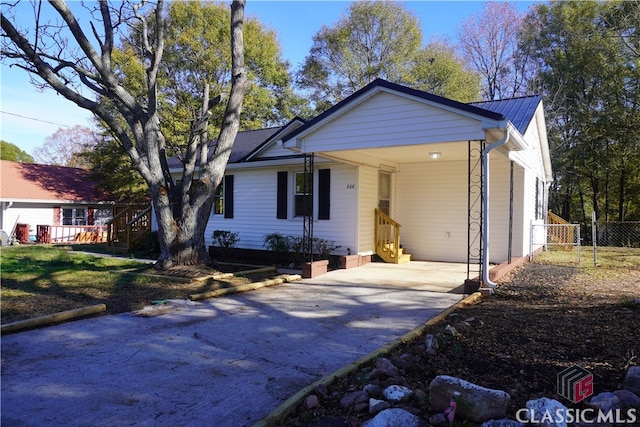 single story home featuring a carport