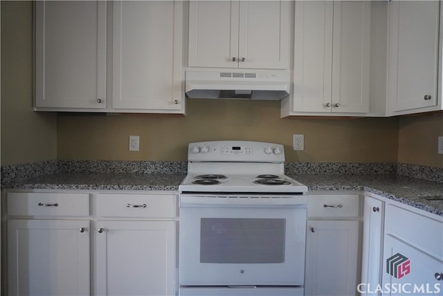 kitchen featuring white cabinets, electric range, and light stone countertops