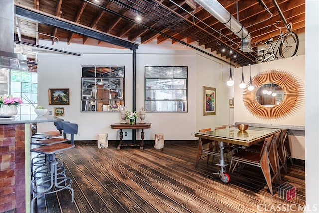 dining space with hardwood / wood-style flooring