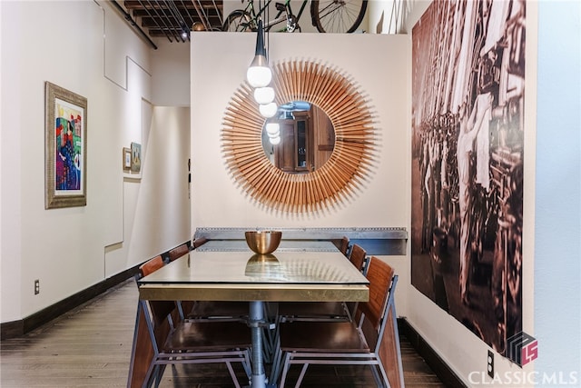 dining area featuring wood-type flooring