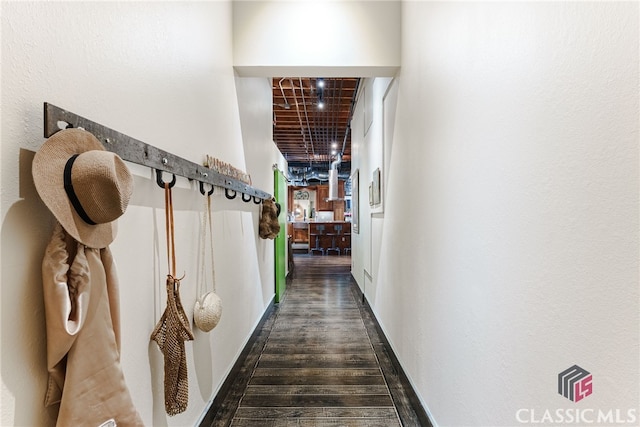 hallway with dark wood-type flooring