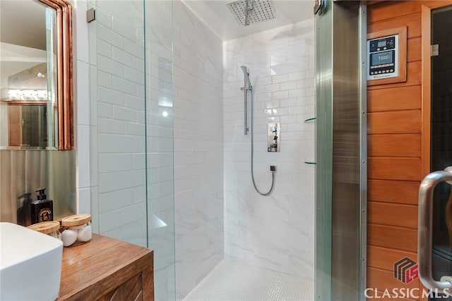 bathroom with a shower with door