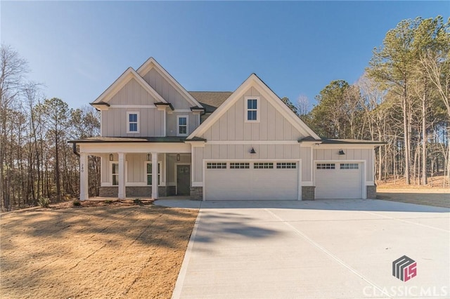 craftsman-style house featuring a garage and covered porch