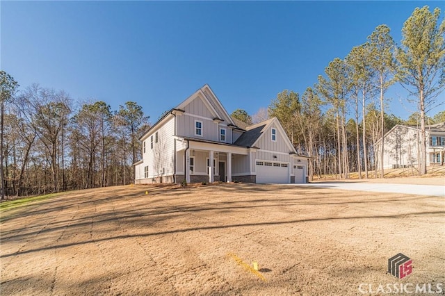 view of front of house with a garage and a porch